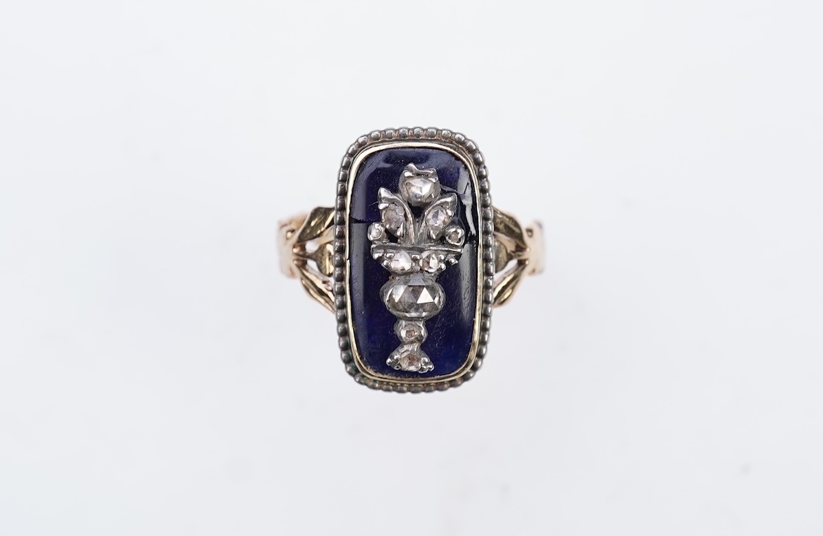 A diamond and blue glass ring